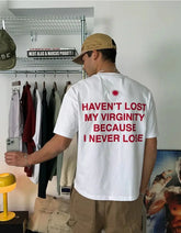 Funny Men’s White Graphic T-Shirt – “Haven’t Lost My Virginity Because I Never Lose” Statement Tee